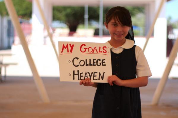 Student holding sign