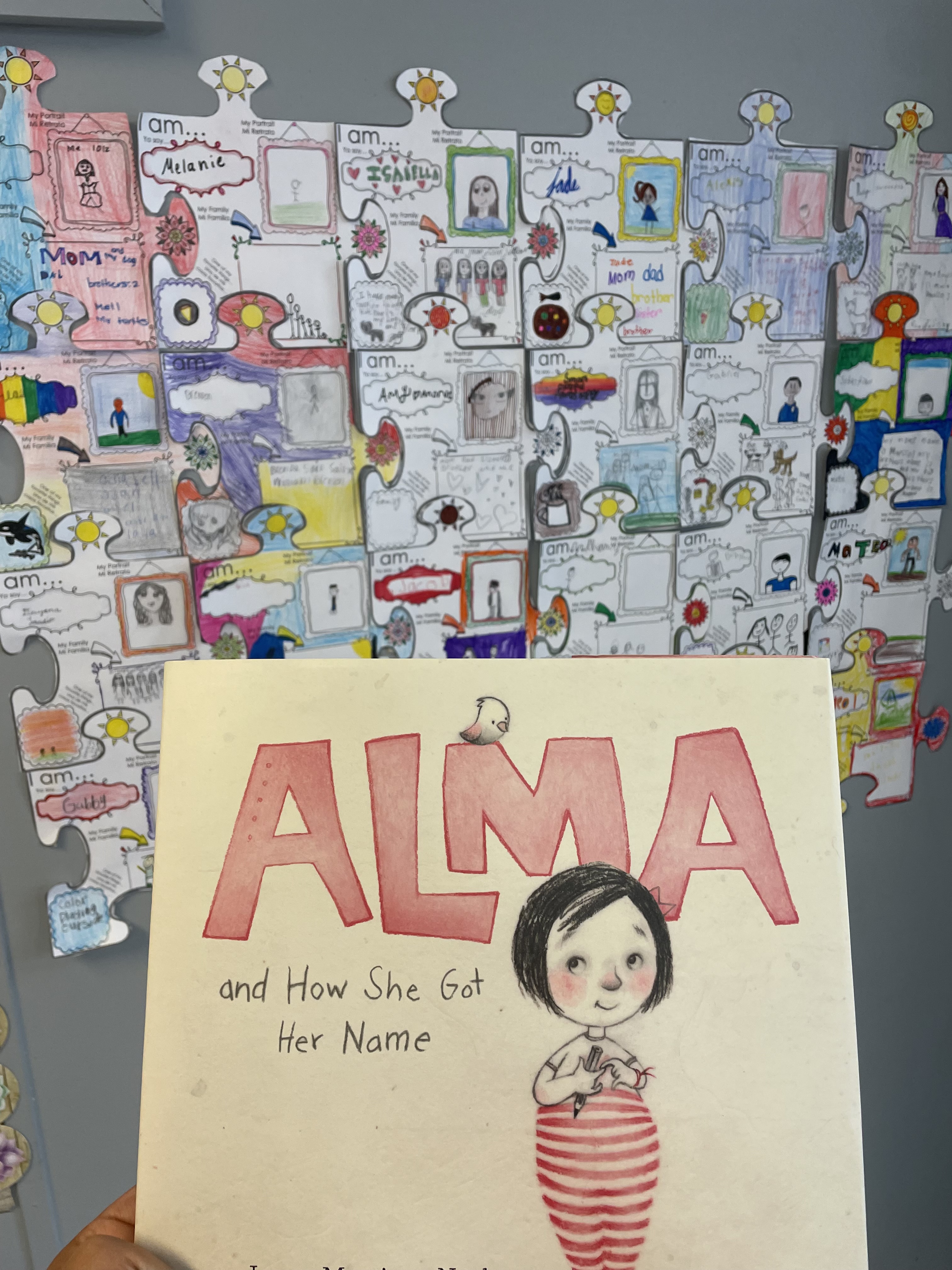Our first day of school read-aloud with our "I Am" puzzle piece display. 