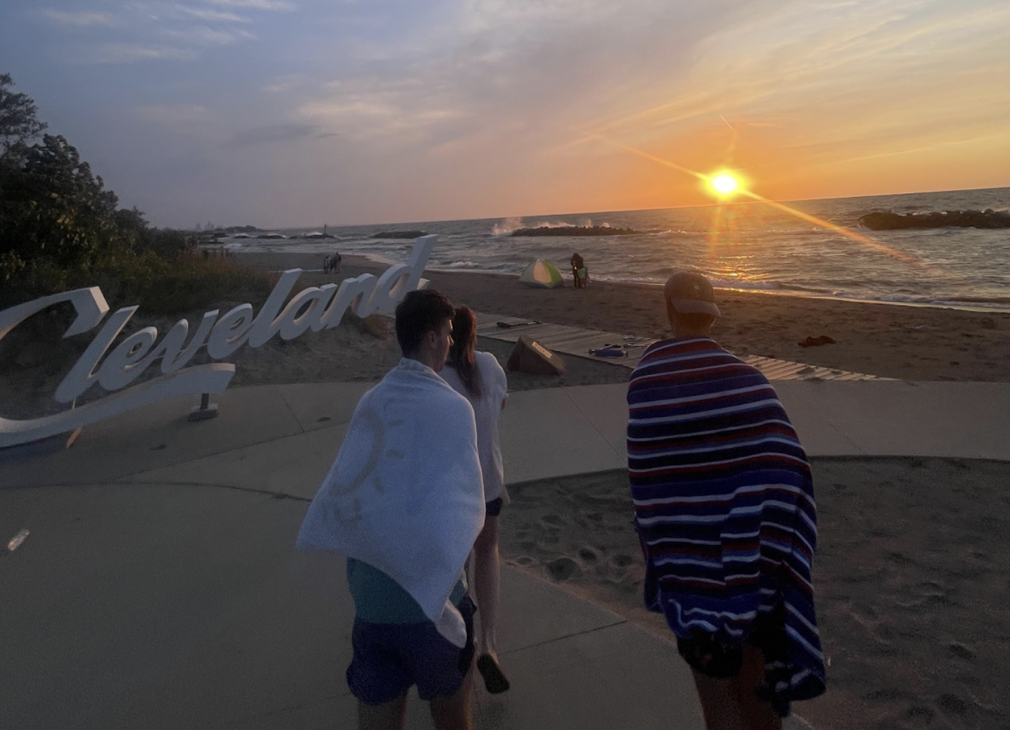 Members of ACE Cleveland walking along Lake Eerie after jumping in the water