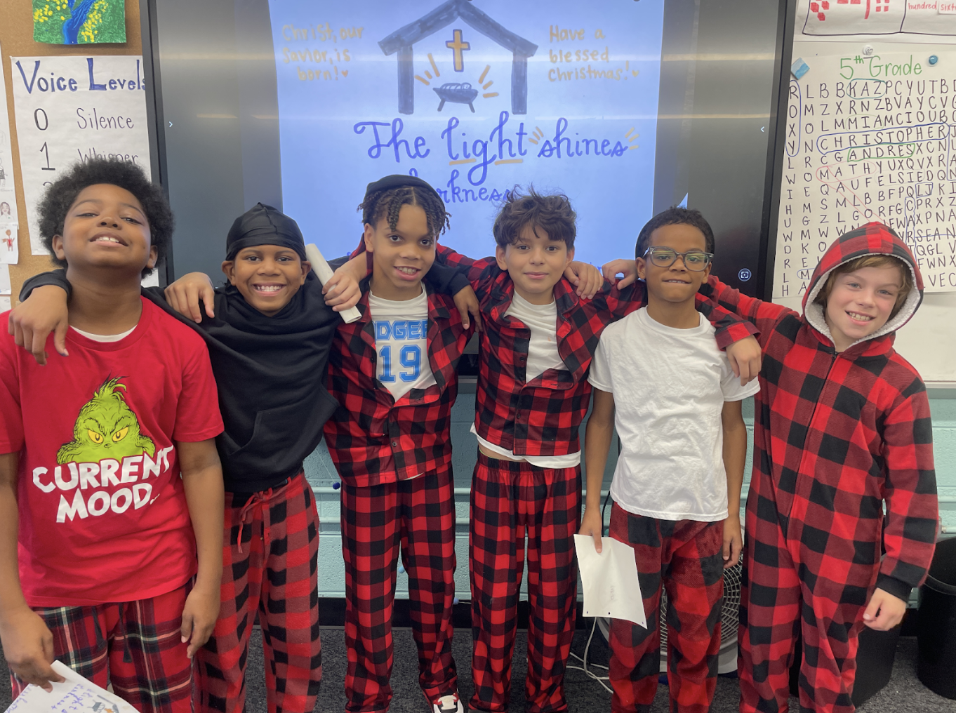 Ms. Schroeder's students posed for photo with Christmas clothes on