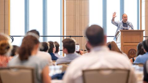 Annunciation Catholic School Principal Matt DeBoer speaks to audience in sun-filled room on campus at the University of Notre Dame