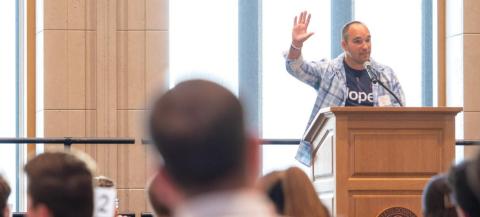 Annunciation Catholic School Principal Matt DeBoer speaks to audience in sun-filled room on campus at the University of Notre Dame