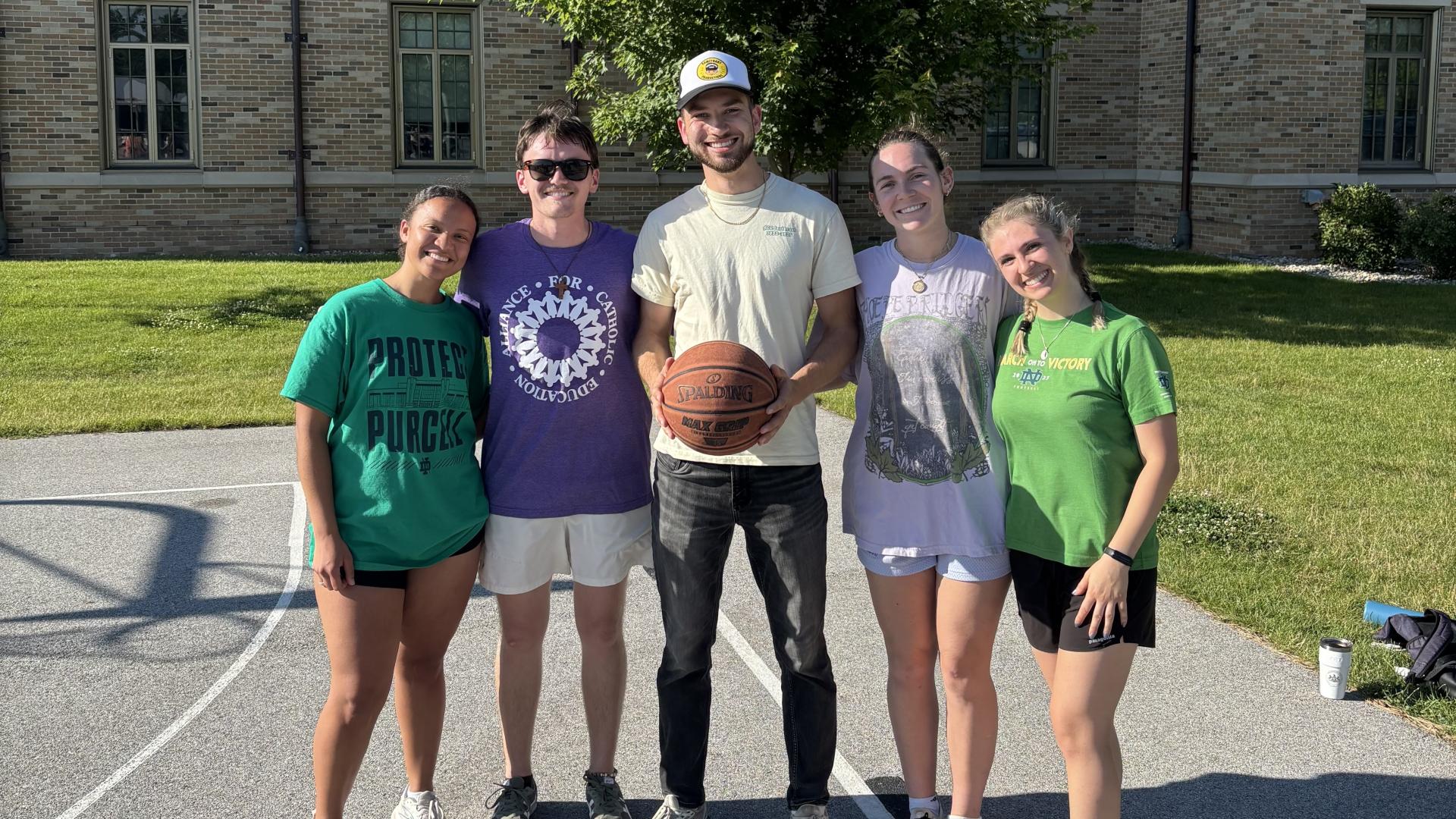 Image of ACE New Orleans on the basketball court. From left to right: Amanda Dempson, James Walsh, Jordan Pavlock, Caelan O'Connor, and Sophia Buonavolonta